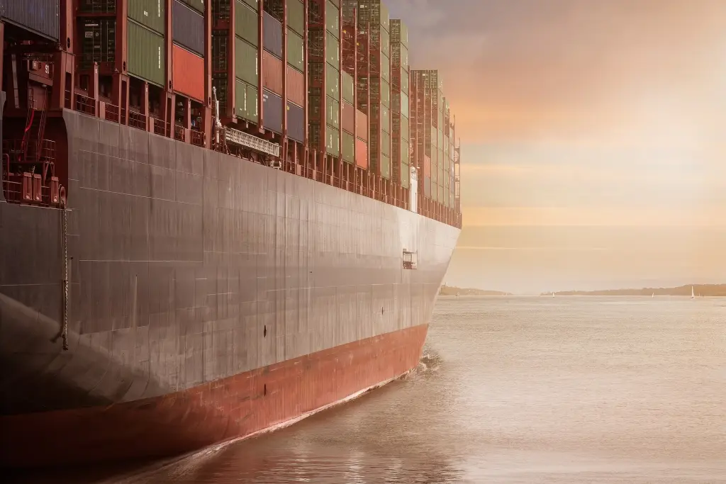 Container ship under way at sea, representing VELA VERITAS maritime classification and safety services.